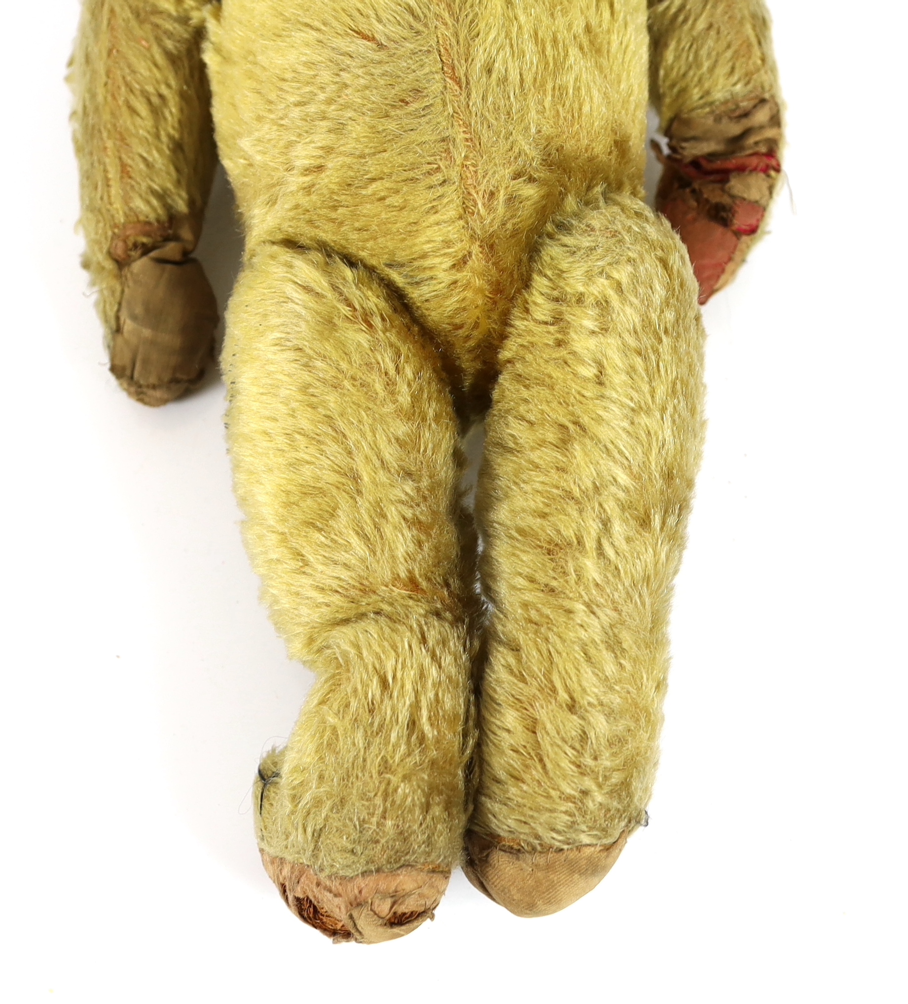 An early German bear, c.1912, black button eyes, 45cm, old repair to paws, good mohair